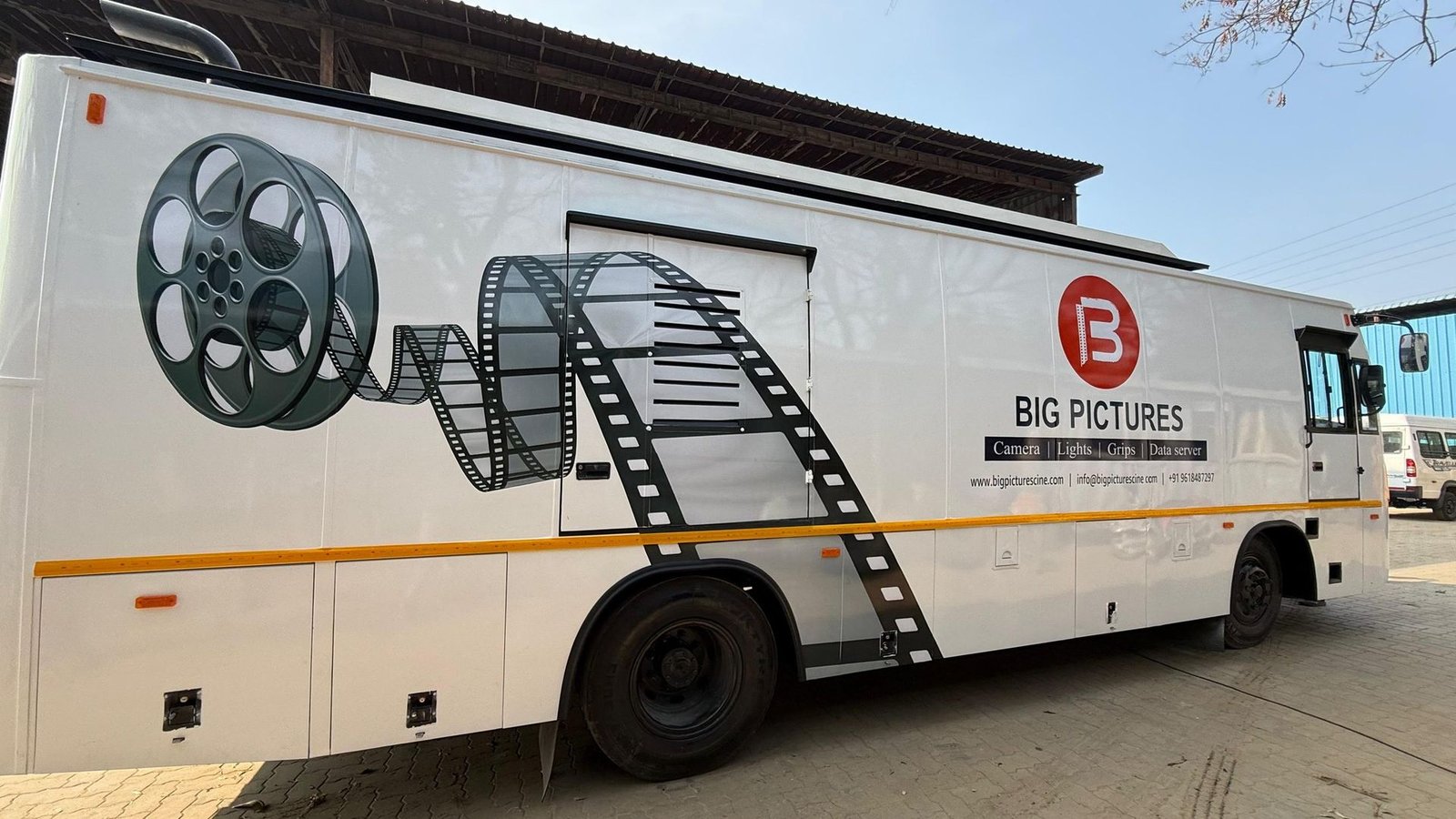 Big Pictures branded outdoor unit vehicle, side profile